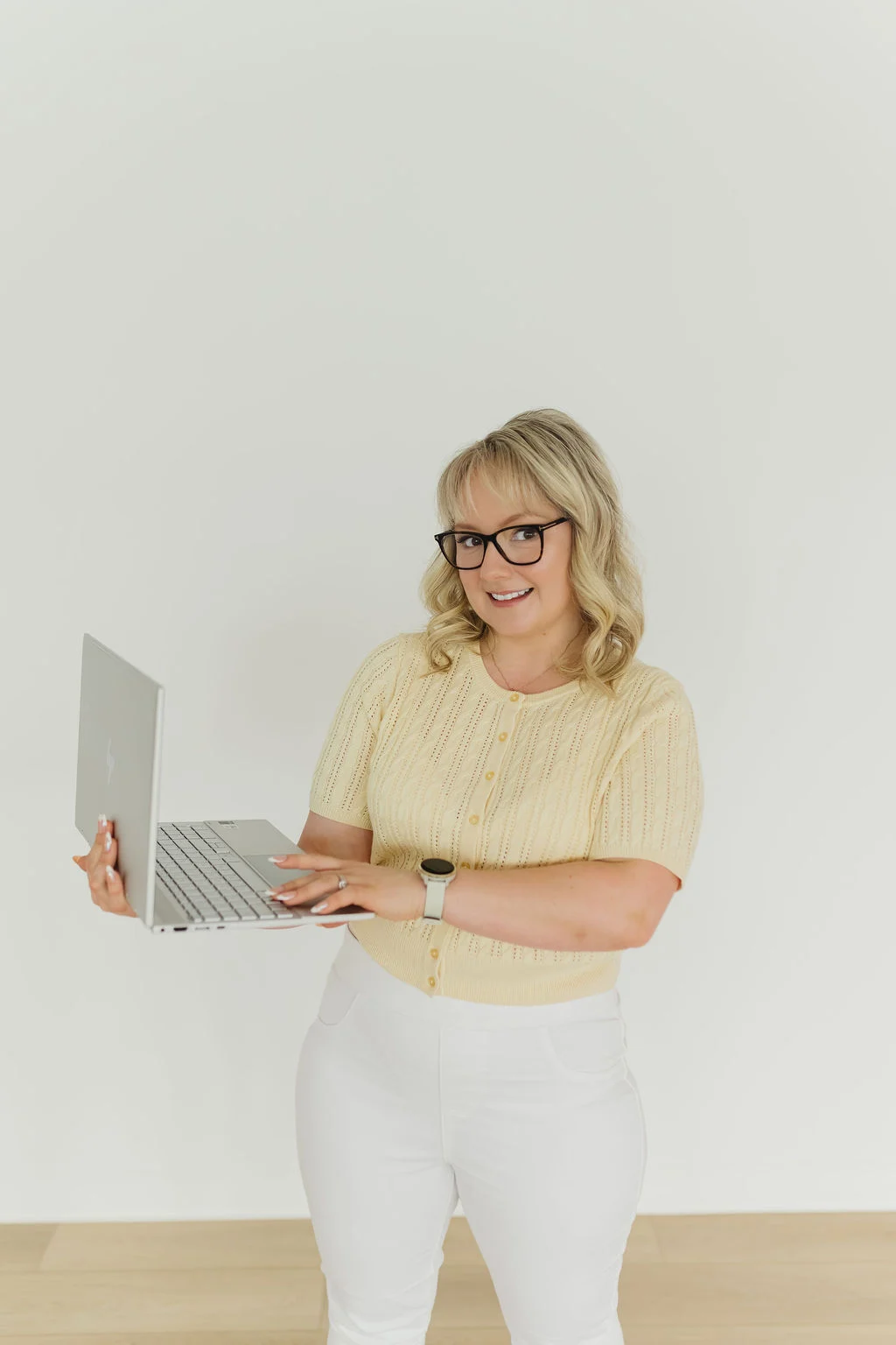 Founder and Growth Strategist, Stephanie Kegalj, showcasing computer - Google Ads & Social Media Ads Edmonton