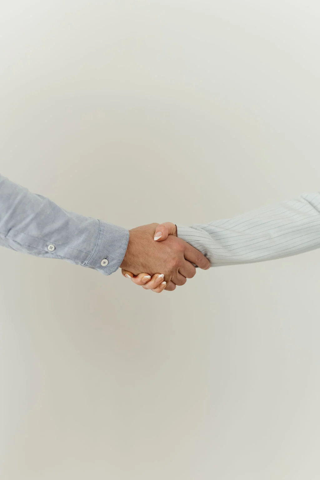 Cue2Convert shaking hands with a client after showcasing their Paid Advertising Process Edmonton.