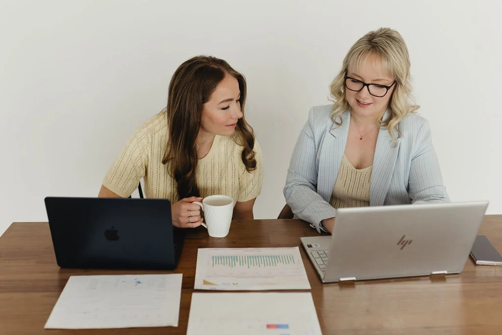 Stephanie showing Melody the work behind a Google Ads Management Edmonton